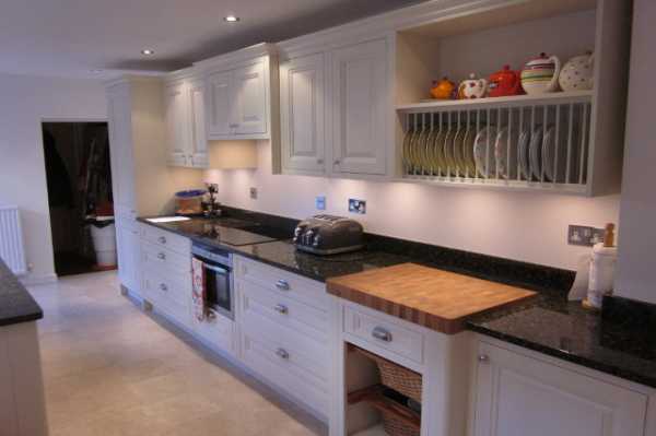 This shows the finished modern kitchen with integrated chopping board